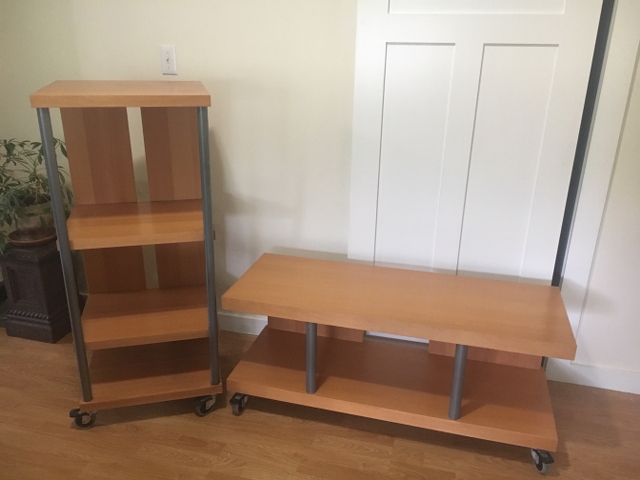 High end laminate and metal rolling coffee table and shelving unit.